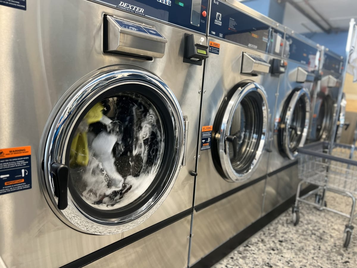 Dexter commercial washer in action washing clothes