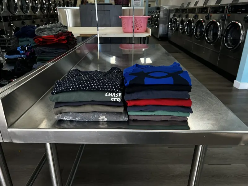 Professional wash and fold service - neatly folded clothes